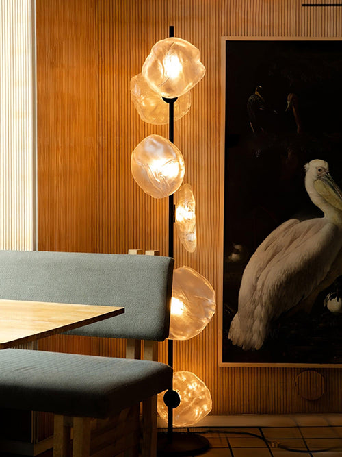 Aether Bloom Floor Lamp with handcrafted smoked glass petal shades arranged along a minimalist black metal frame, creating sculptural ambient lighting for luxury interiors.