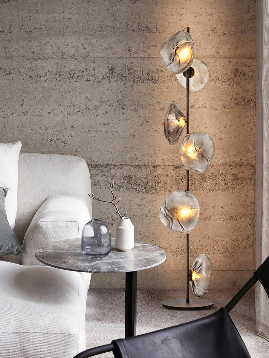 Aether Bloom Floor Lamp with handcrafted smoked glass petal shades arranged along a minimalist black metal frame, creating sculptural ambient lighting for luxury interiors.