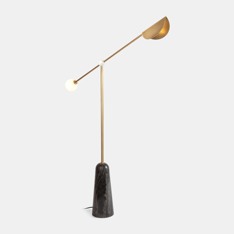Alonzo Floor Lamp featuring a sculptural brass frame, frosted glass globe, directional metal reflector, and luxurious marble base, designed for contemporary luxury interiors