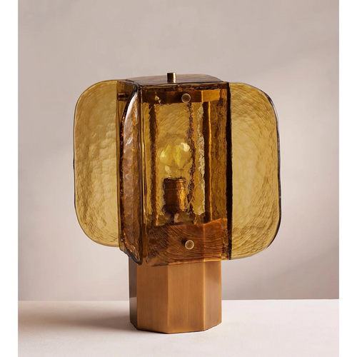Ambra Table Lamp featuring handcrafted amber glass panels and a sculptural metal base, a luxury Art Deco-inspired lighting piece for sophisticated interiors