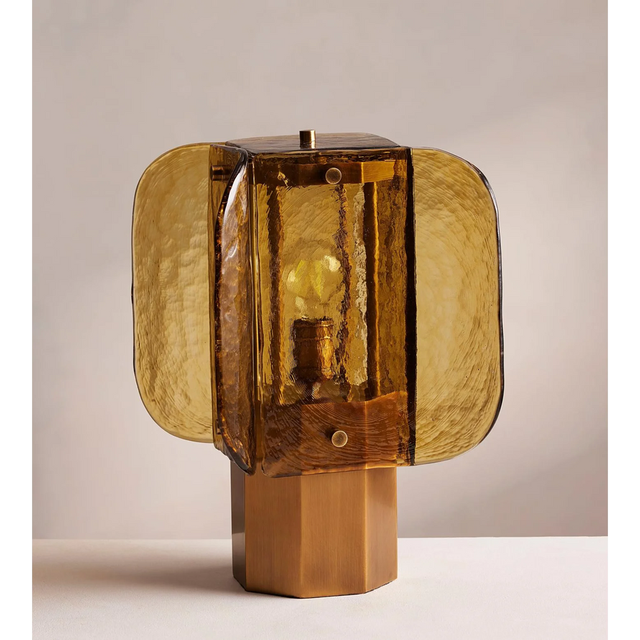 Ambra Table Lamp featuring handcrafted amber glass panels and a sculptural metal base, a luxury Art Deco-inspired lighting piece for sophisticated interiors