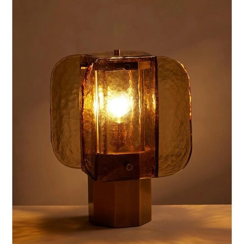 Ambra Table Lamp featuring handcrafted amber glass panels and a sculptural metal base, a luxury Art Deco-inspired lighting piece for sophisticated interiors