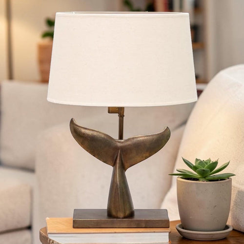 Sculptural table lamp with whale tail base