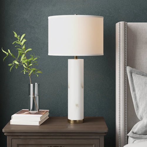Arden alabaster table lamp with white shade on modern console