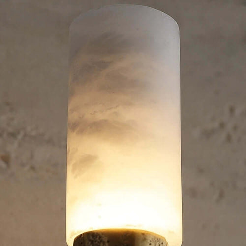 Atelier Sconce crafted from hand-forged brass and natural marble, a luxury wall light featuring sculptural texture and warm ambient illumination