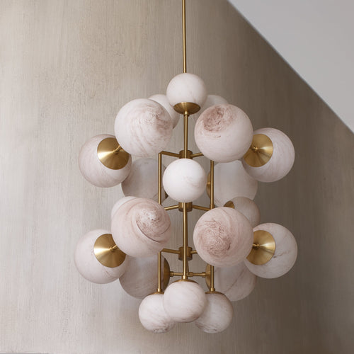 Celestia Alabaster Chandelier featuring handcrafted alabaster globes and brass detailing, a luxury statement light for grand dining rooms and contemporary interiors.