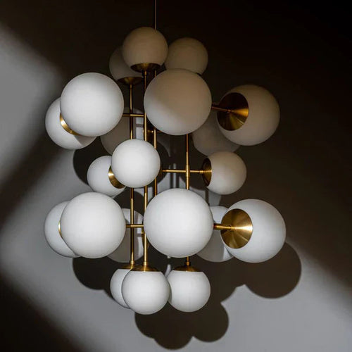 Celestia Alabaster Chandelier featuring handcrafted alabaster globes and brass detailing, a luxury statement light for grand dining rooms and contemporary interiors