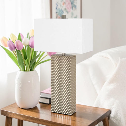 Gold ceramic table lamp with geometric textured base