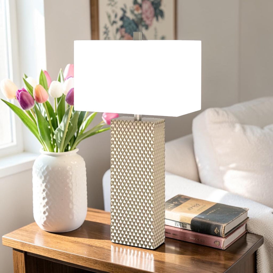 Gold ceramic table lamp with geometric textured base