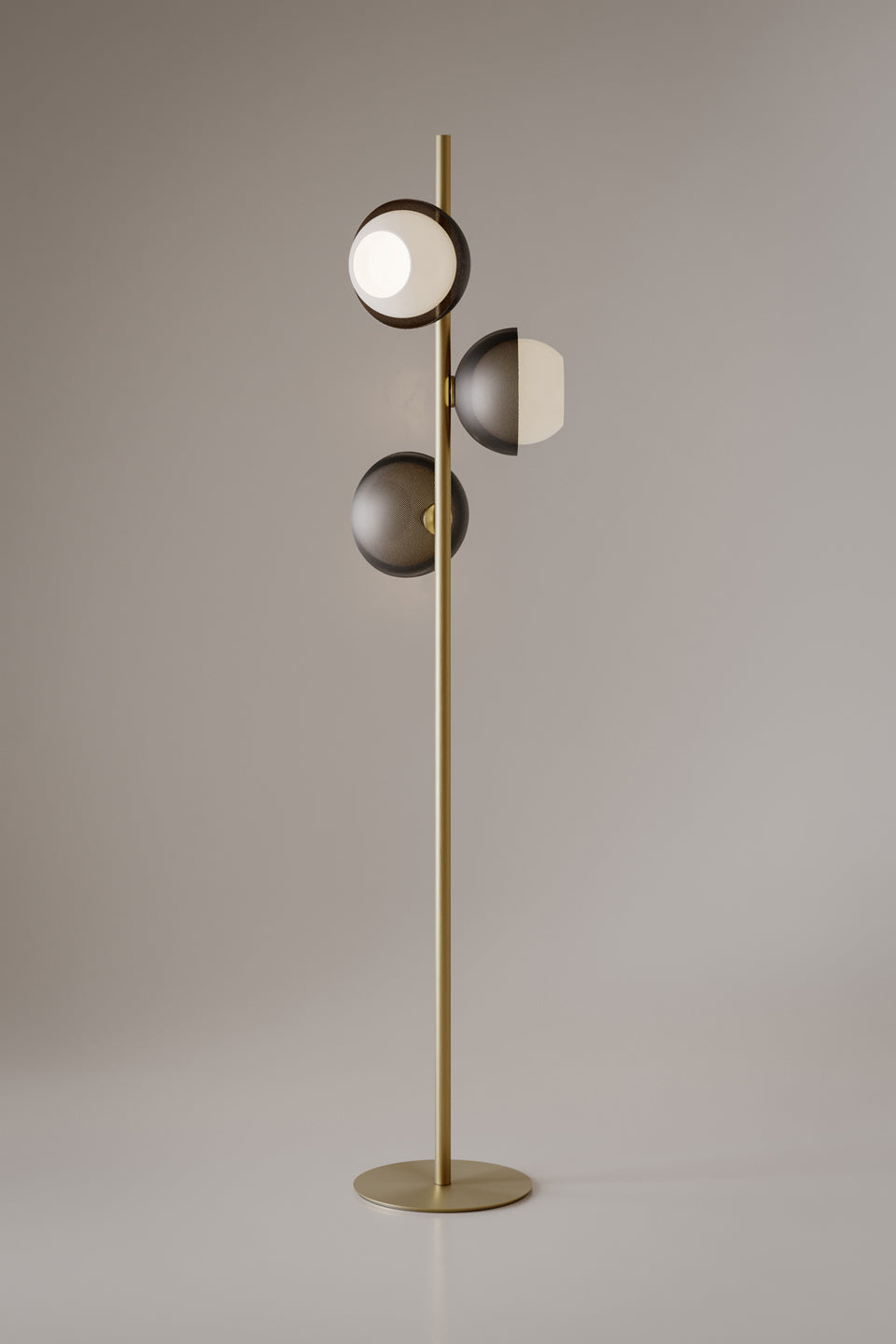 Evo Floor Lamp featuring illuminated frosted glass discs and a sculptural brass frame, designed as a contemporary statement lighting piece for luxury interiors