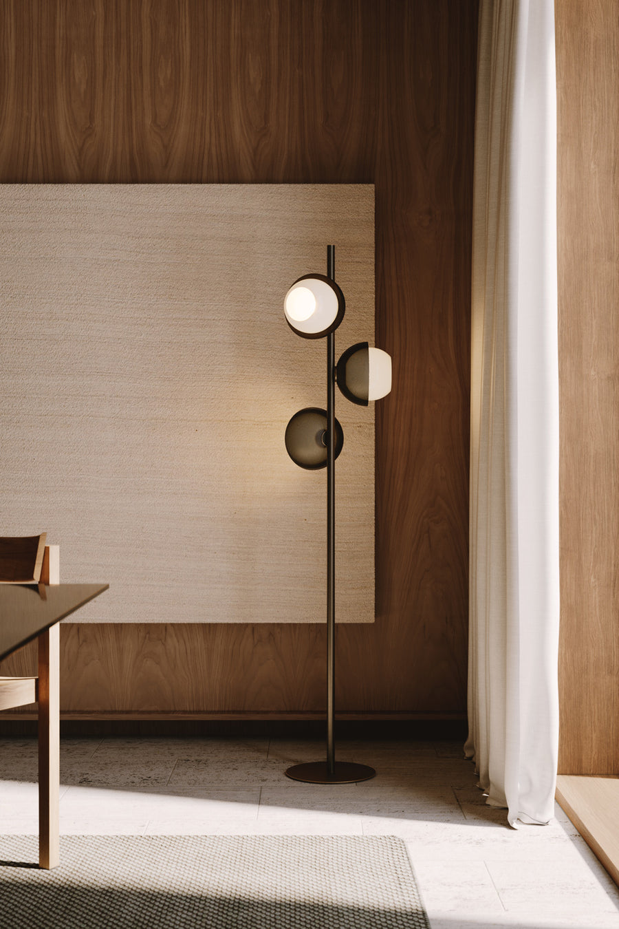 Evo Floor Lamp featuring illuminated frosted glass discs and a sculptural brass frame, designed as a contemporary statement lighting piece for luxury interiors