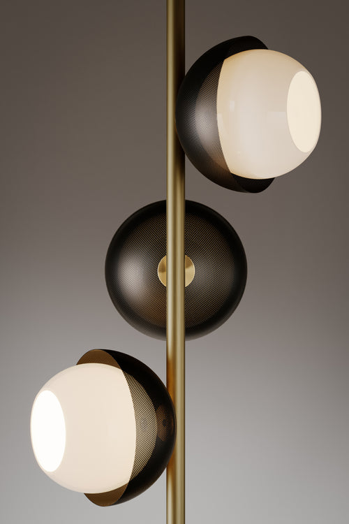 Evo Floor Lamp featuring illuminated frosted glass discs and a sculptural brass frame, designed as a contemporary statement lighting piece for luxury interiors