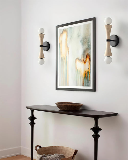 Hecker Travertine Wall Lamp featuring a sculptural natural stone body with dual globe lights and matte black hardware, designed for luxury contemporary interiors.