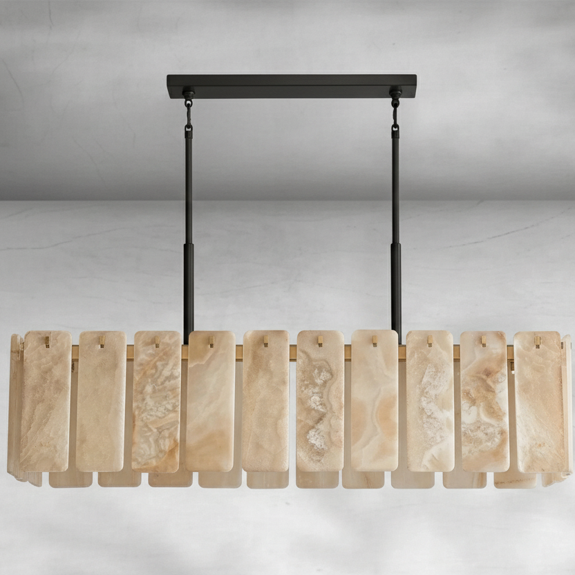 Lunara Linear Chandelier crafted from natural alabaster panels and solid brass, a luxury statement light designed for dining rooms and sophisticated interiors