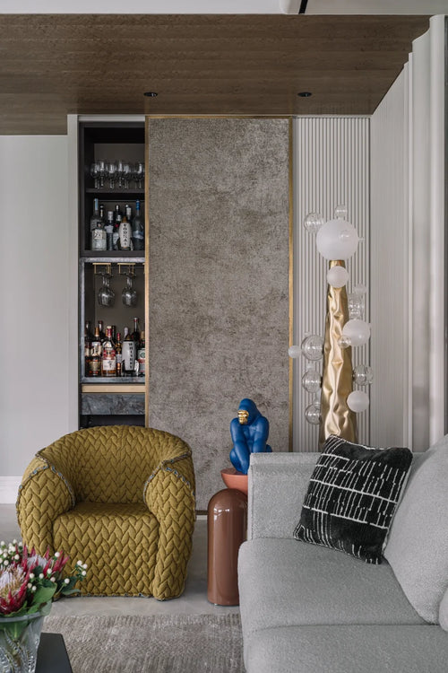 Molecule Floor Lamp featuring hand-blown glass spheres arranged around a sculptural matte gunmetal column, a luxury statement lighting piece for contemporary interiors.
