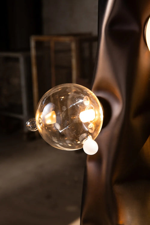 Molecule Floor Lamp featuring hand-blown glass spheres arranged around a sculptural matte gunmetal column, a luxury statement lighting piece for contemporary interiors.