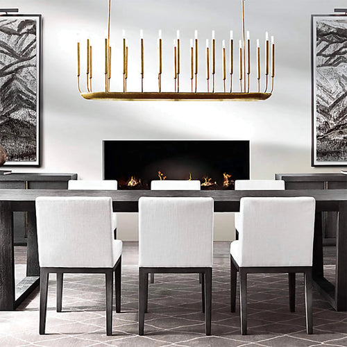 Noir Atelier Chandelier featuring slender candle-inspired LED lights on a minimalist Gold metal frame, designed for modern dining rooms and architectural interiors