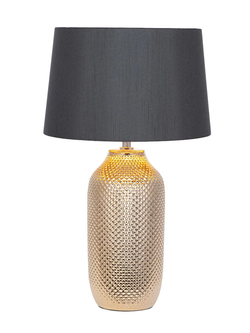 Decorative table lamp with textured base and dark gray shade on a white background