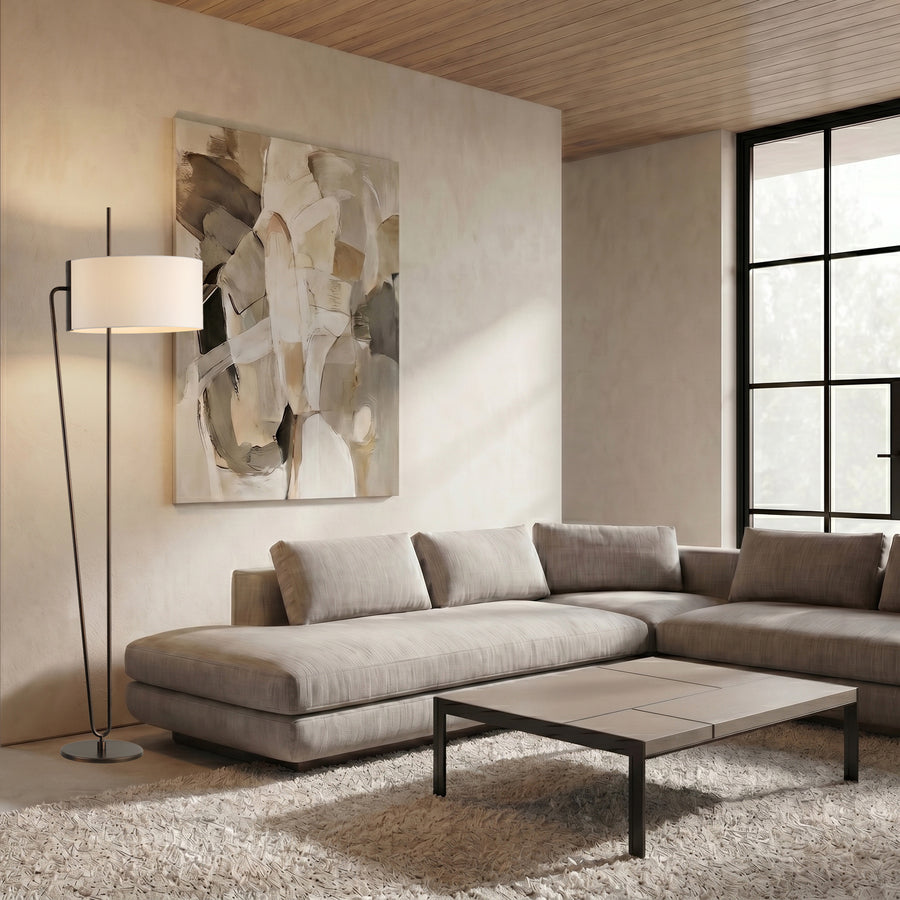 Raven Floor Lamp featuring a sculptural bronze metal frame and floating ivory drum shade, designed for luxury contemporary and minimalist interiors