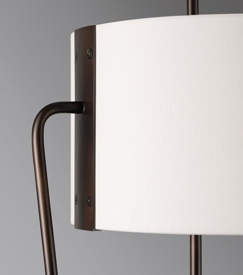 Raven Floor Lamp featuring a sculptural bronze metal frame and floating ivory drum shade, designed for luxury contemporary and minimalist interiors