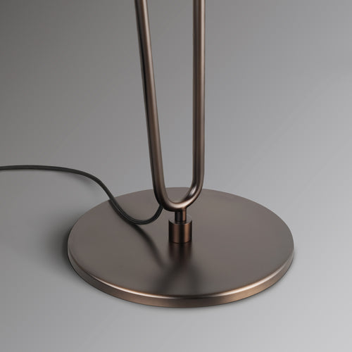 Raven Floor Lamp featuring a sculptural bronze metal frame and floating ivory drum shade, designed for luxury contemporary and minimalist interiors