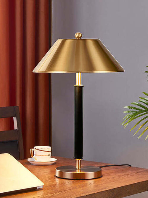 close up brass metal shade table lamp gold finish