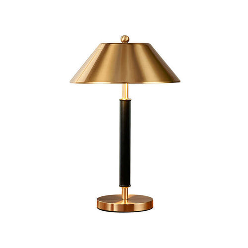close up brass metal shade table lamp gold finish