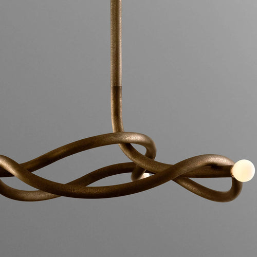 Seraphina Chandelier featuring a sculptural intertwined bronze frame with glass accents, a luxury Mid-Century modern statement light for sophisticated interiors