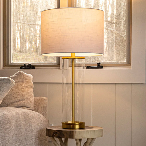 glass column table lamp with gold base and white shade