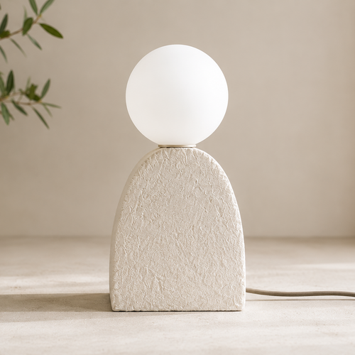 Terra Orb Table Lamp with a handcrafted textured ivory ceramic base and frosted glass globe, providing warm ambient lighting for Japandi and contemporary interiors
