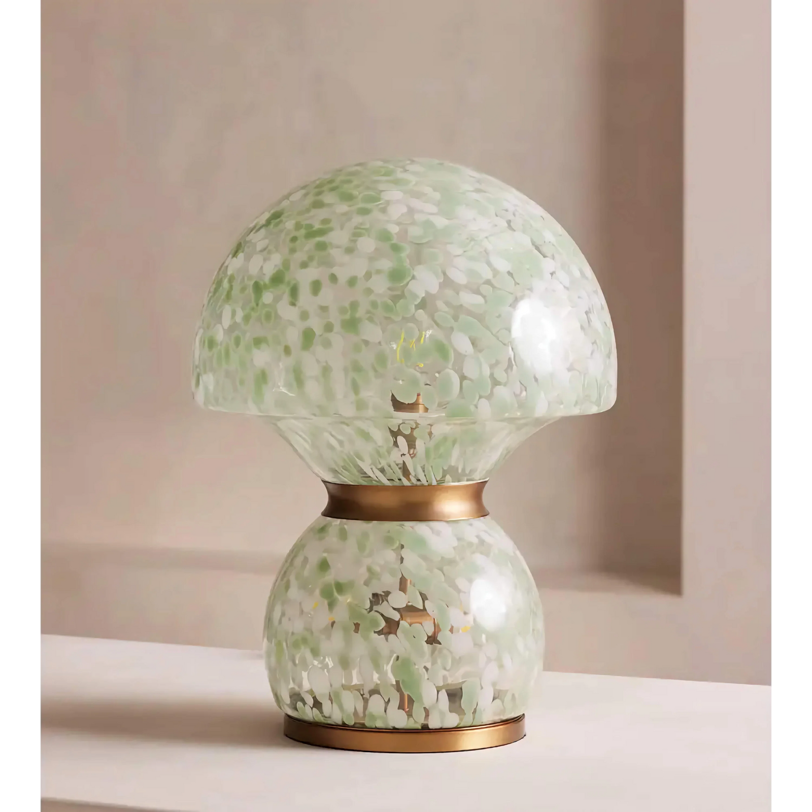 Verde Murano Table Lamp featuring hand-blown green and ivory speckled glass with elegant copper accents, a luxury statement lamp inspired by Murano craftsmanship