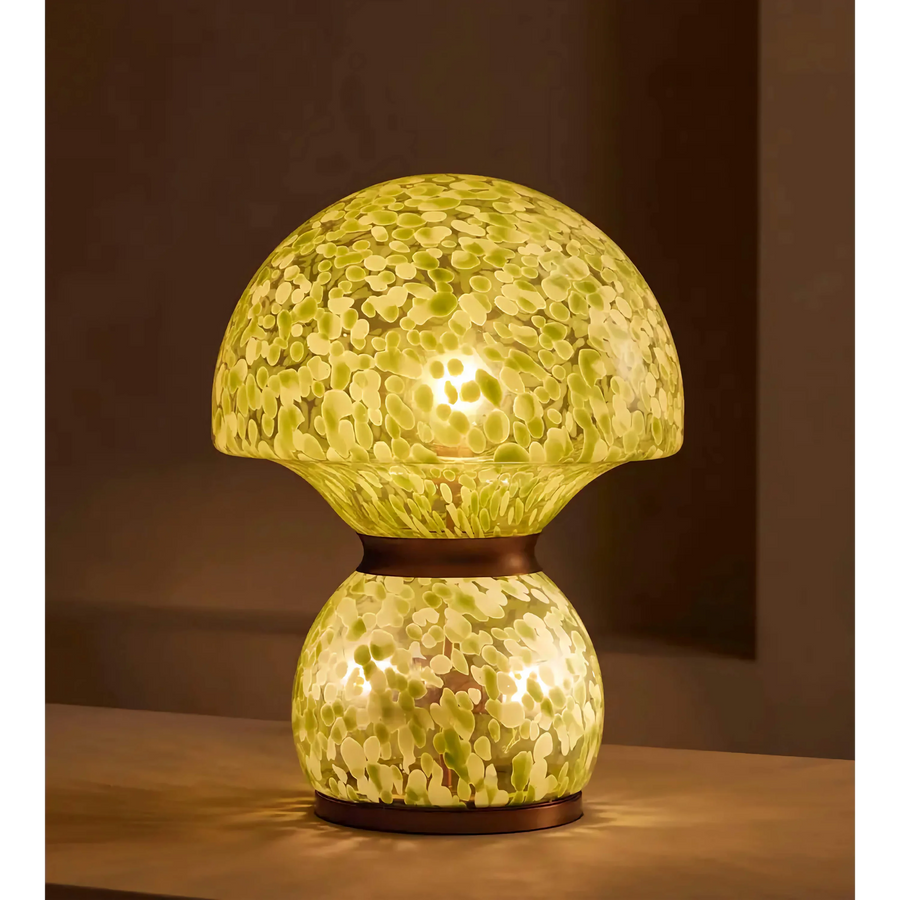 Verde Murano Table Lamp featuring hand-blown green and ivory speckled glass with elegant copper accents, a luxury statement lamp inspired by Murano craftsmanship