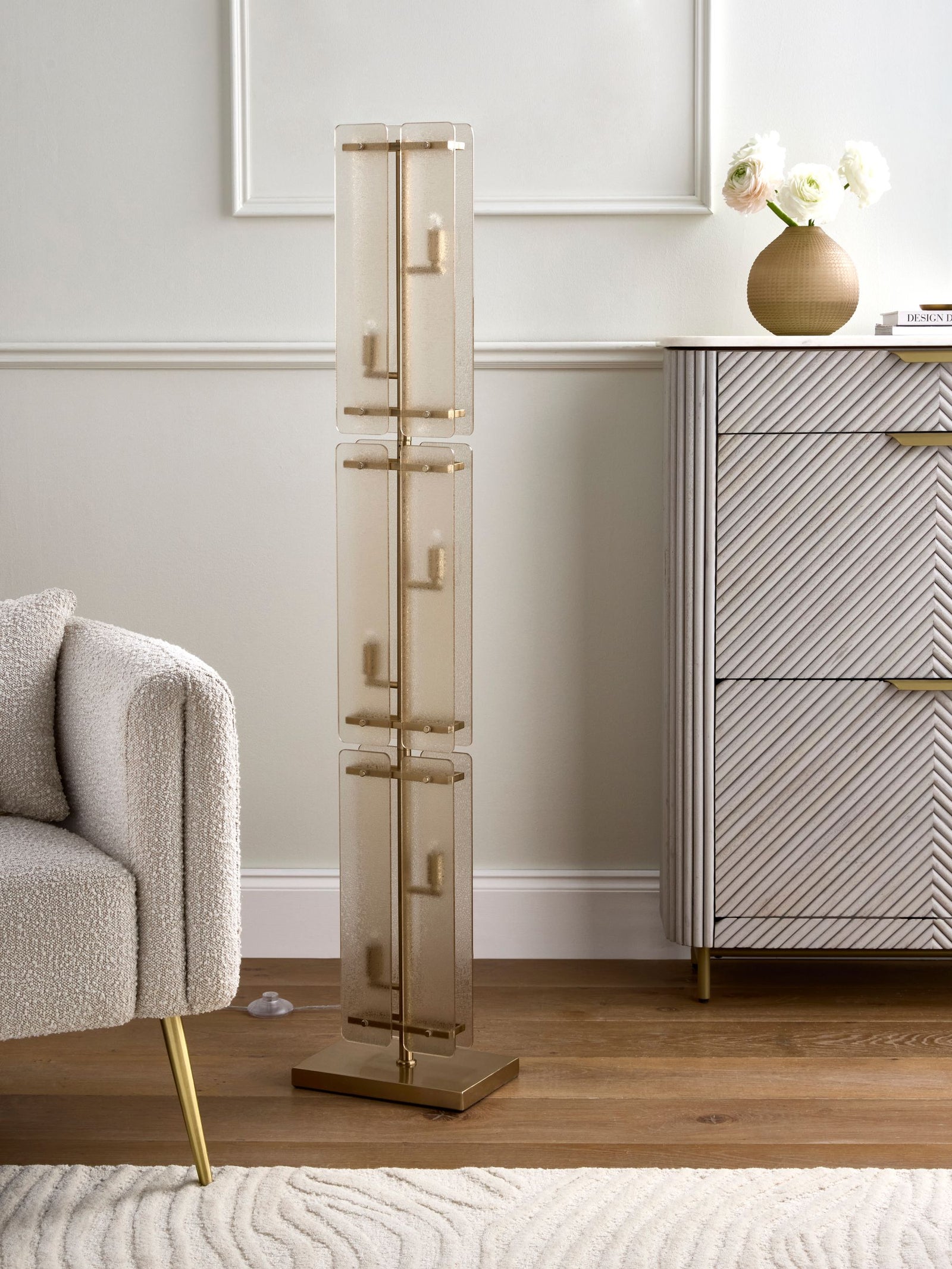Vesper Floor Lamp featuring stacked textured glass panels and antique brass detailing, a luxury statement floor light for contemporary interiors