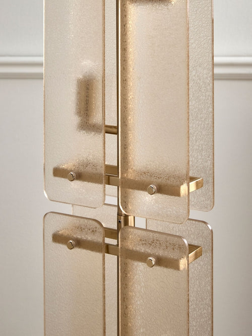 Vesper Floor Lamp featuring stacked textured glass panels and antique brass detailing, a luxury statement floor light for contemporary interiors