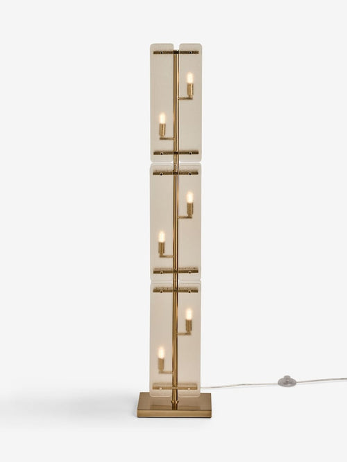 Vesper Floor Lamp featuring stacked textured glass panels and antique brass detailing, a luxury statement floor light for contemporary interiors