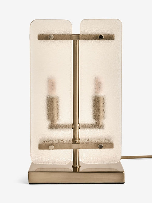 Vesper Table Lamp featuring textured glass panels and antique brass detailing, a luxury bedside and console lamp with warm ambient illumination