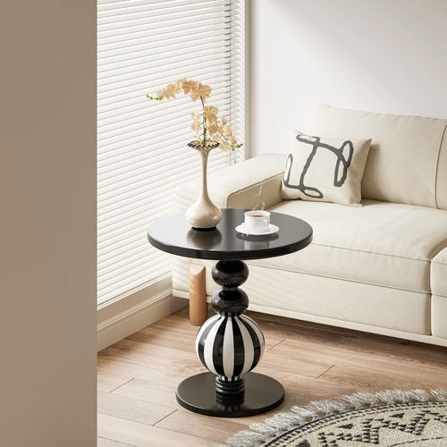 Bellagio black and white striped pedestal side table in a modern living room