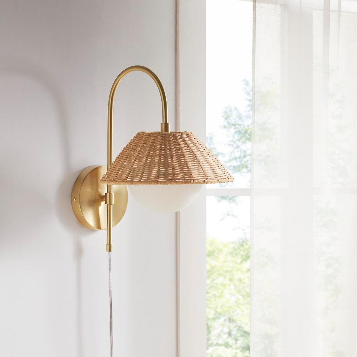 Maris gold wall lamp with natural woven rattan shade