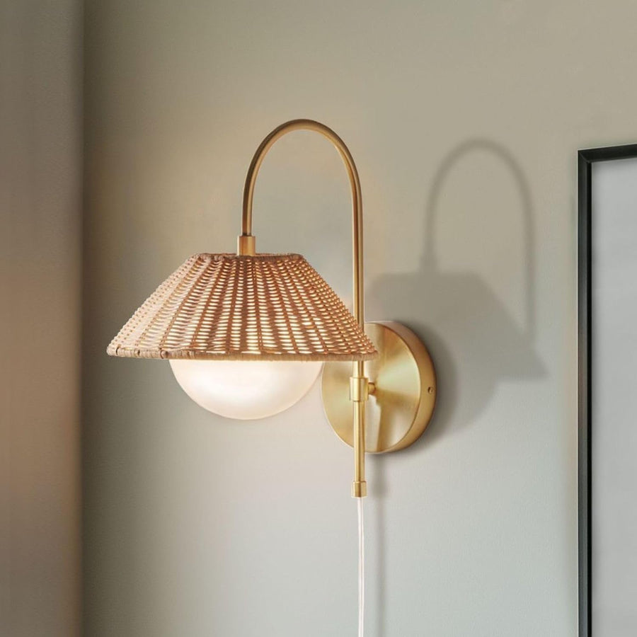 Maris gold wall lamp with natural woven rattan shade